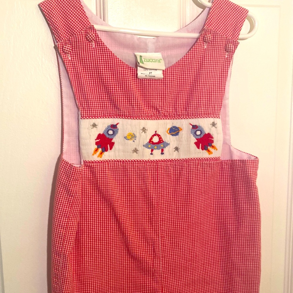 Zuccini red/white gingham longall with smocked spaceships. Size 2T.